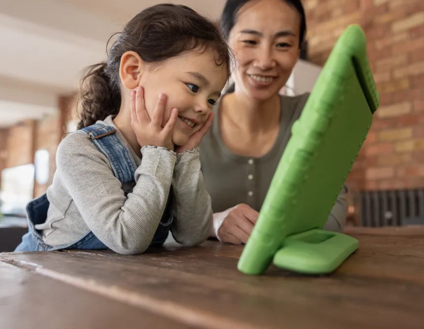Parent and child using tablet together